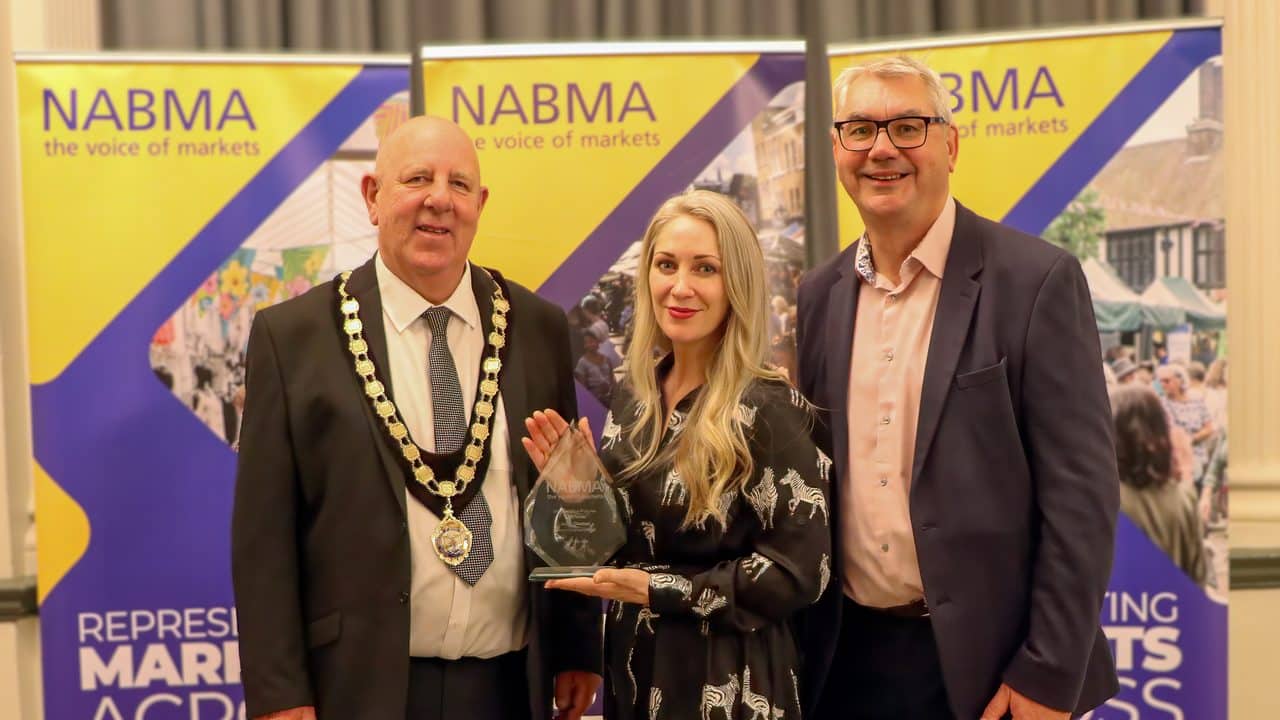 L-R: Councillor David Hopkins, President of NABMA; award winner Adele Thomas of Chester Market; and Mark Parry from ZAPP, the award sponsors.
